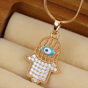 "Rose Gold Hamsa Hand Pendant with Evil Eye and Crystal Accents, XPPT1609